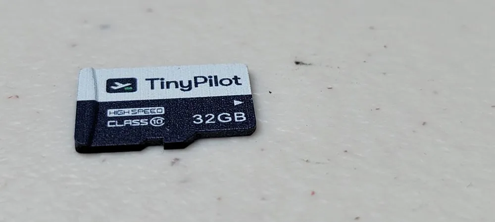 Included 32GB Class 10 microSD card featuring TinyPilot branding and logo Included 32GB Class 10 microSD card featuring TinyPilot branding and logo