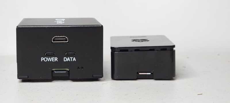 TinyPilot Voyager 2a and CanaKit SD card positioned side by side, SD card facing camera