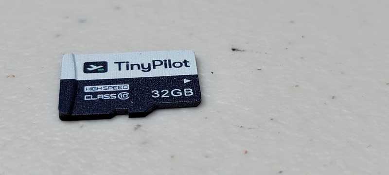 Included 32GB Class 10 microSD card featuring TinyPilot branding and logo